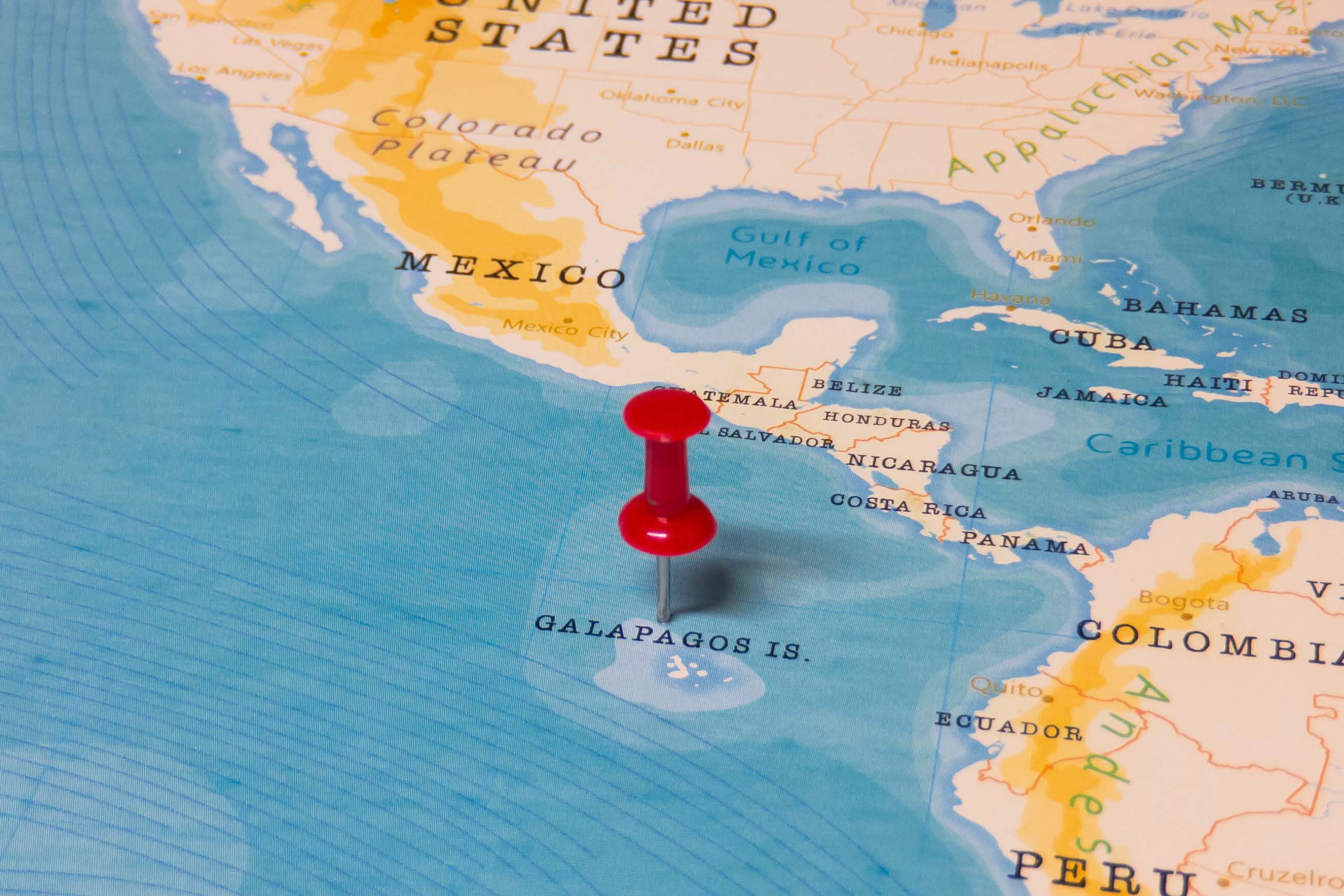 World map with a pushpin in the Galápagos Islands